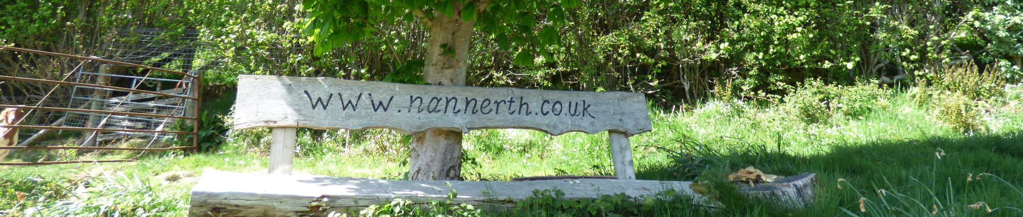 A bench with our cottage for couples and family lodges with hot tubs website engraved